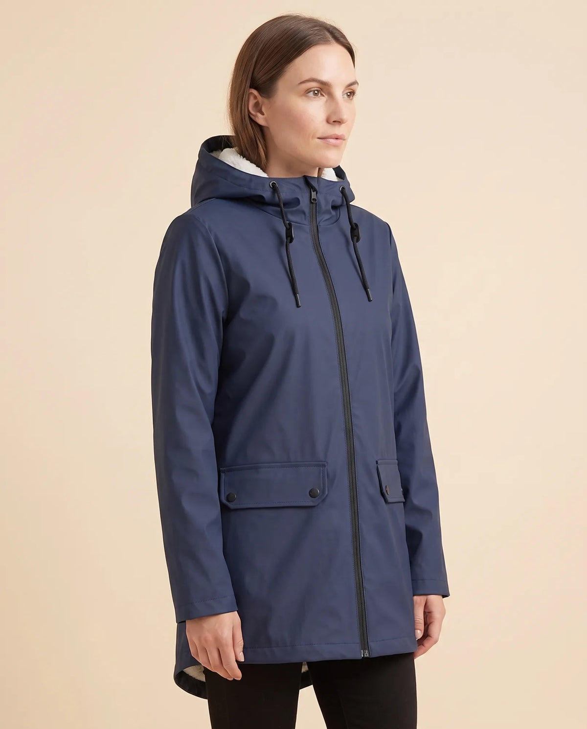 Women's lined hooded coat in navy – angled view showing the coat silhouette