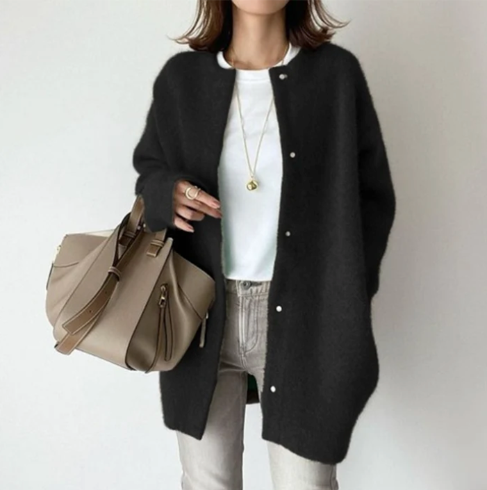 Women's oversized cardigan in black - studio view