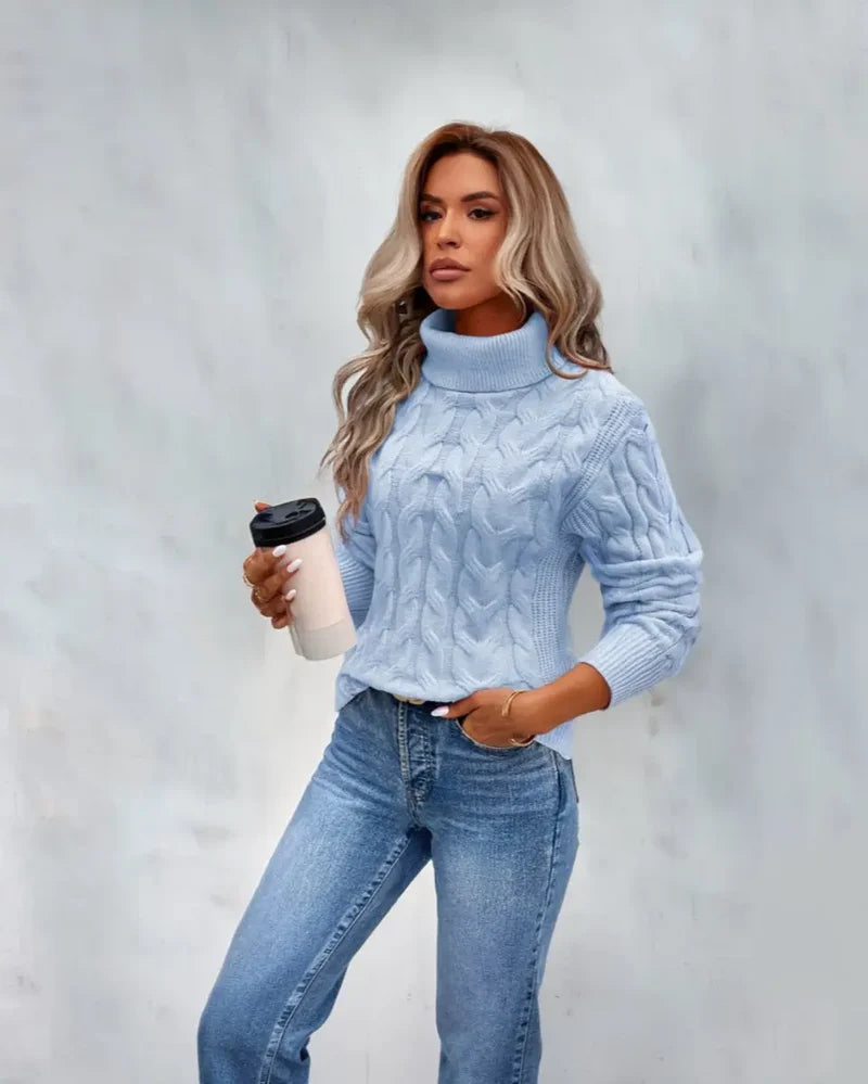 Women's cable knit turtleneck sweater in blue