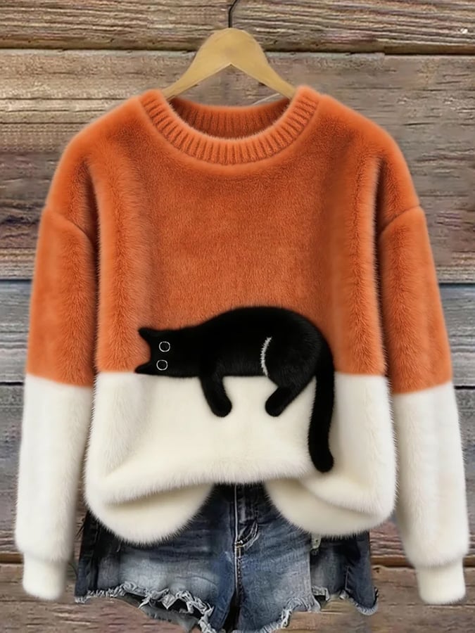 Orange and cream color block sweater with black cat graphic