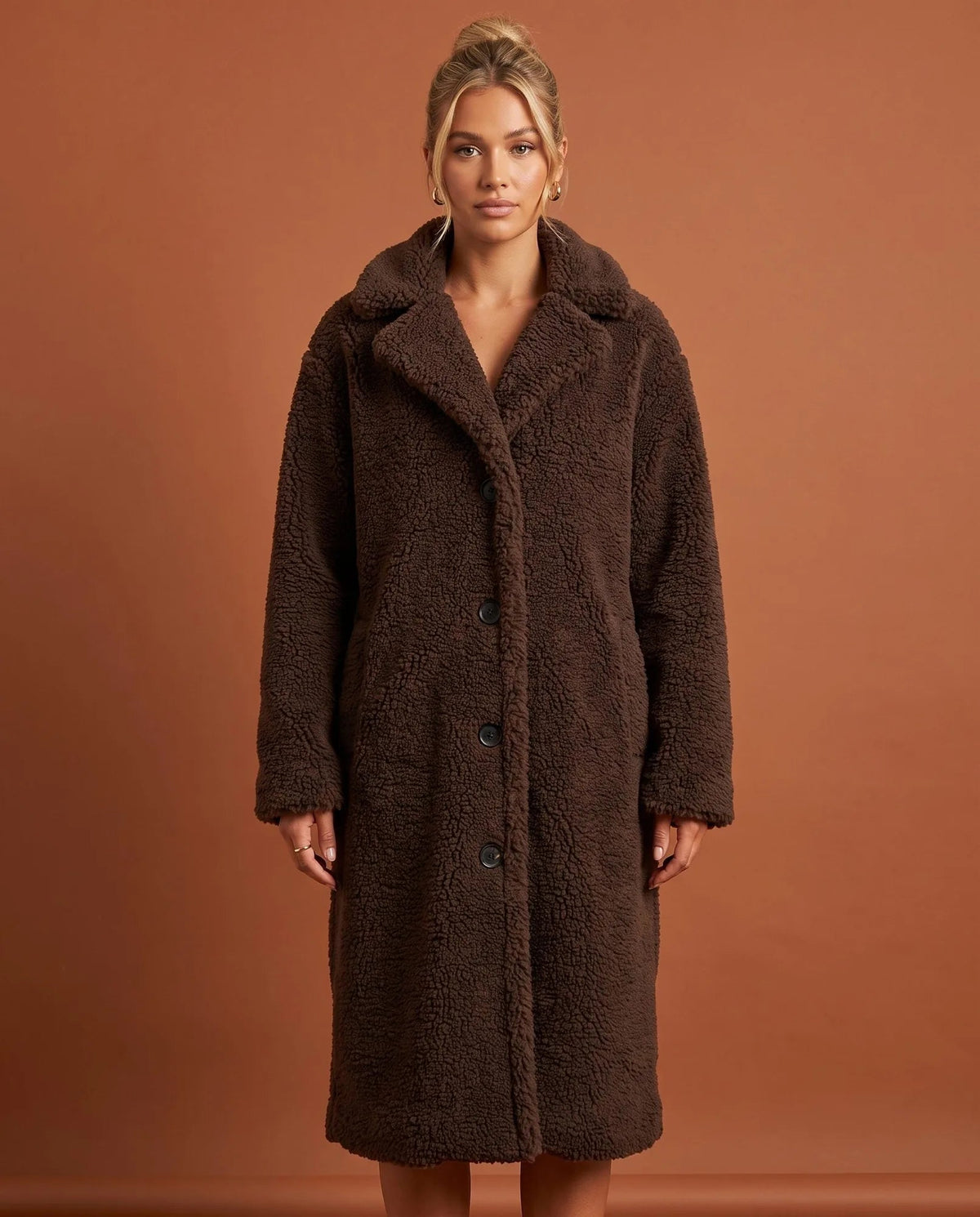 Women's coffee longline teddy fleece coat with notched collar and button front, front view