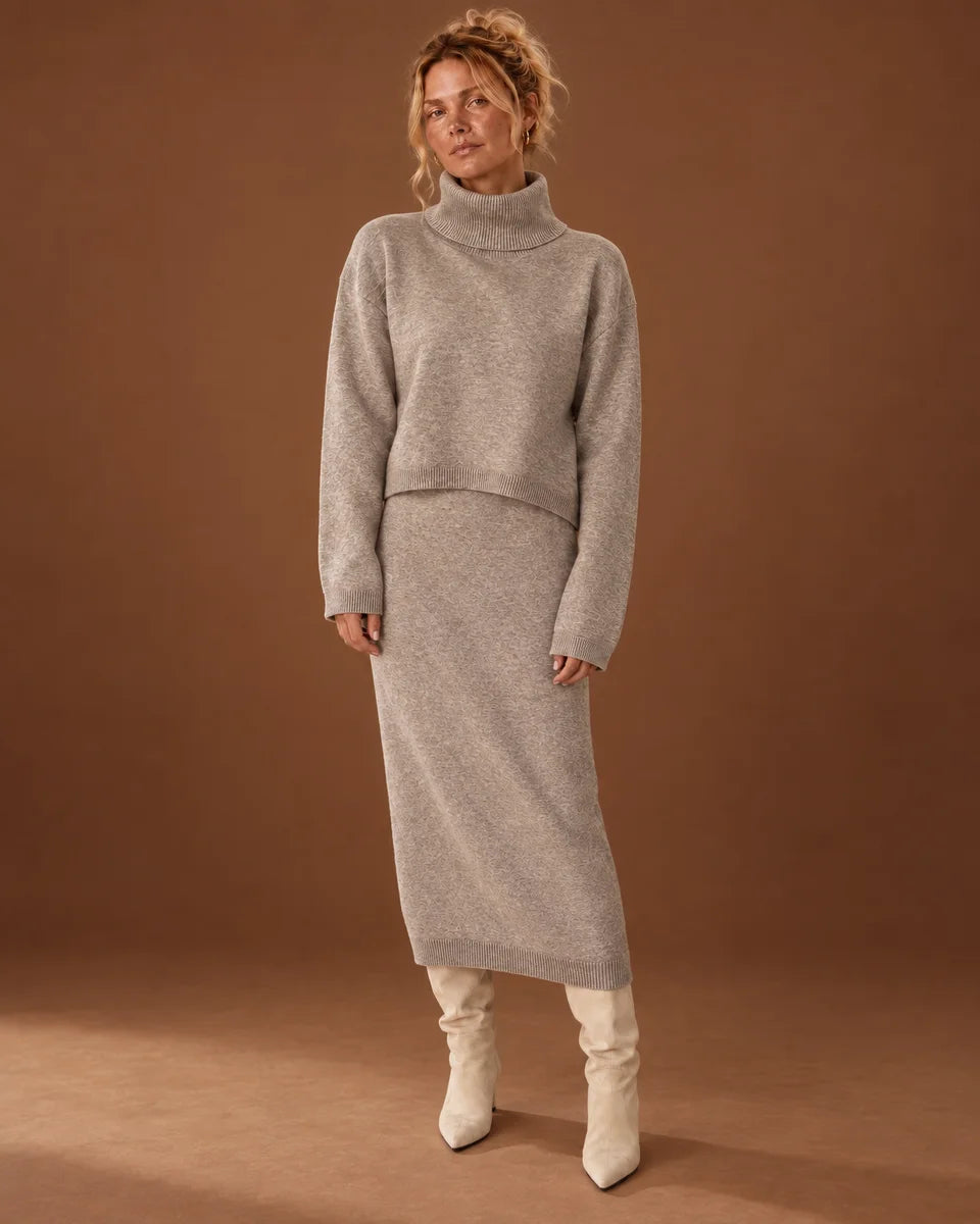 Women's beige two-piece knit set with a cropped turtleneck sweater over a matching midi dress