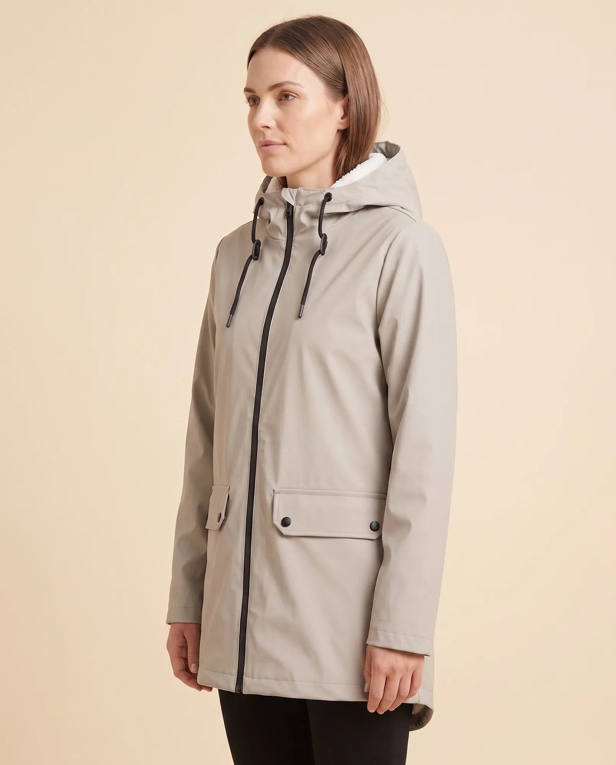 Women's lined hooded coat in beige – angled view showing the coat silhouette