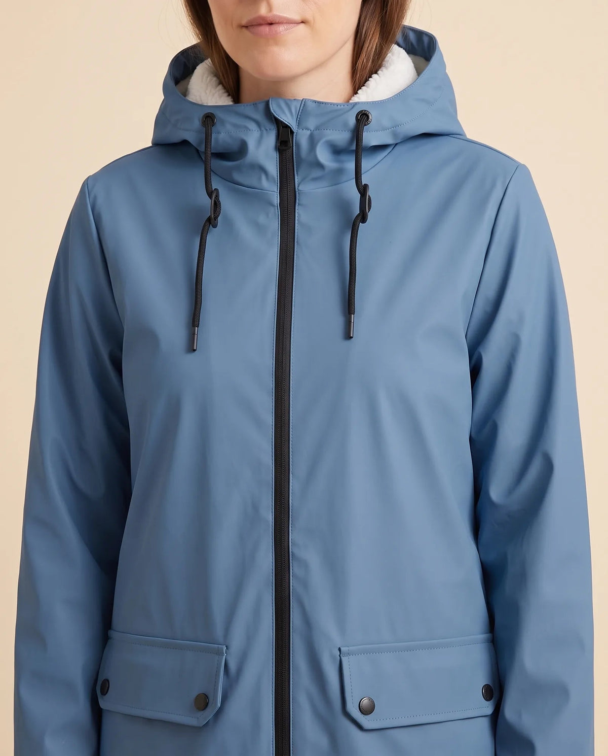 Women's lined hooded coat in blue – close-up of the drawcord hood and zip front