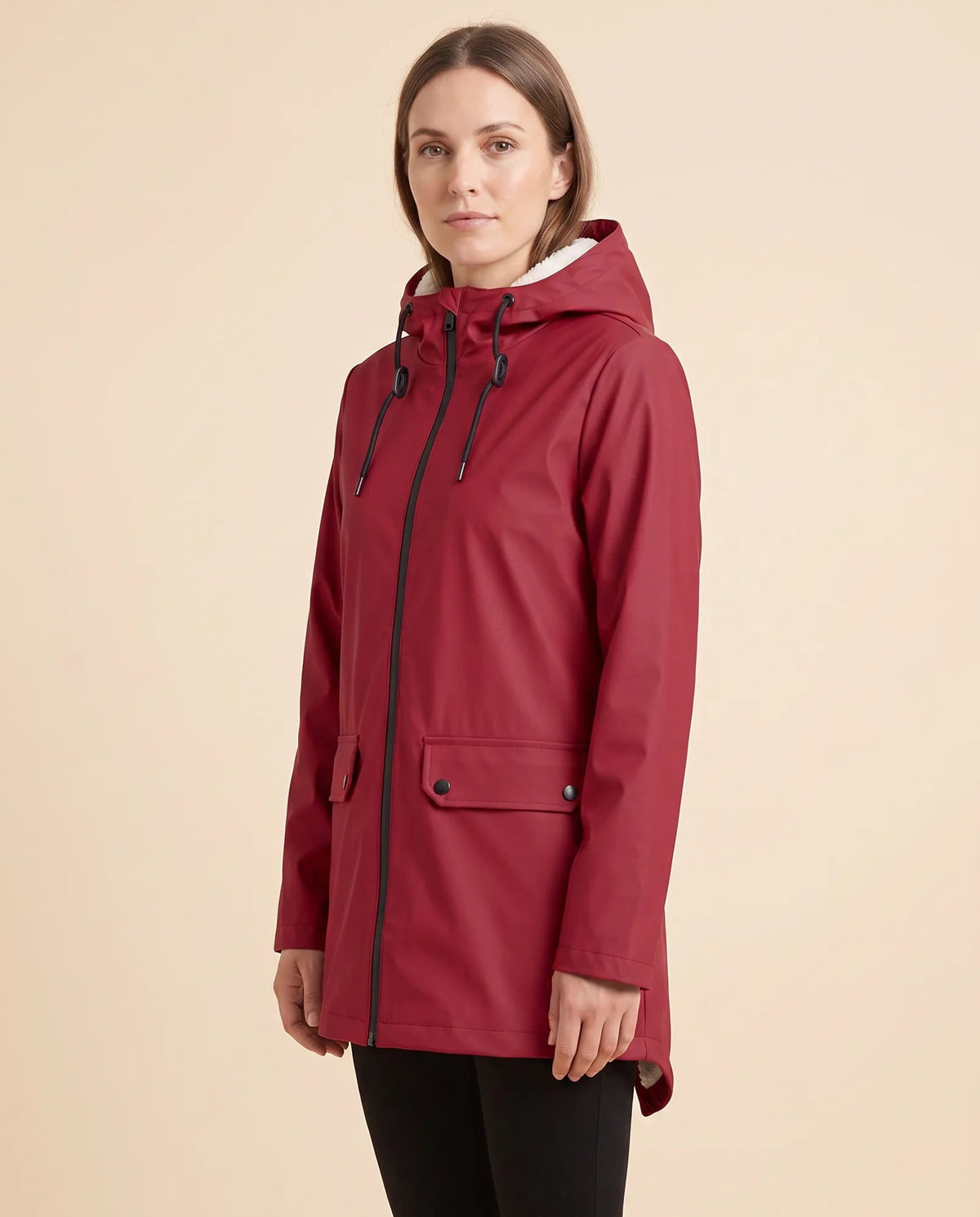 Women's lined hooded coat in red – angled view showing the coat silhouette