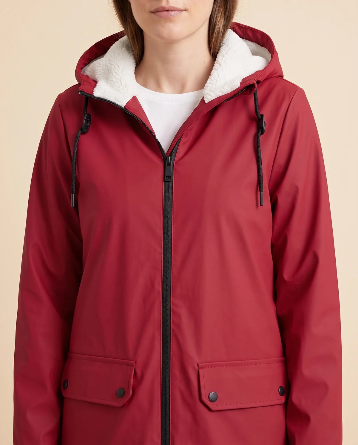 Women's lined hooded coat in red – close-up of the drawcord hood and zip front