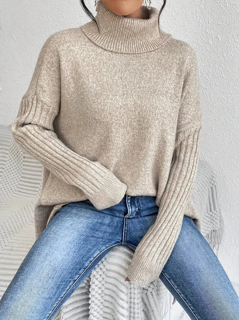 Women's oversized longline ribbed turtleneck sweater in beige - seated view