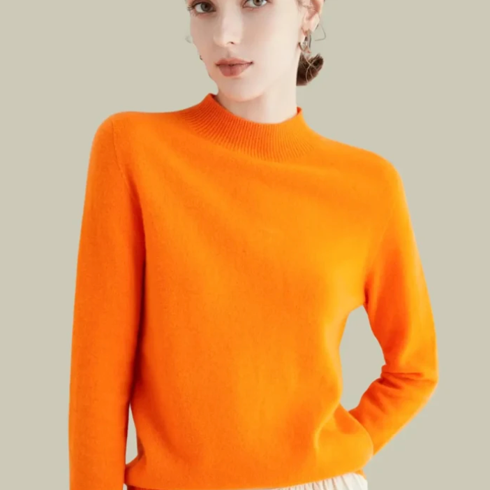Women's mock-neck merino wool knit sweater in bright orange