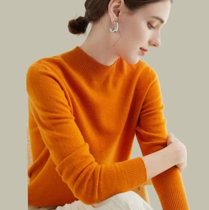 Women's mock-neck merino wool knit sweater in burnt orange