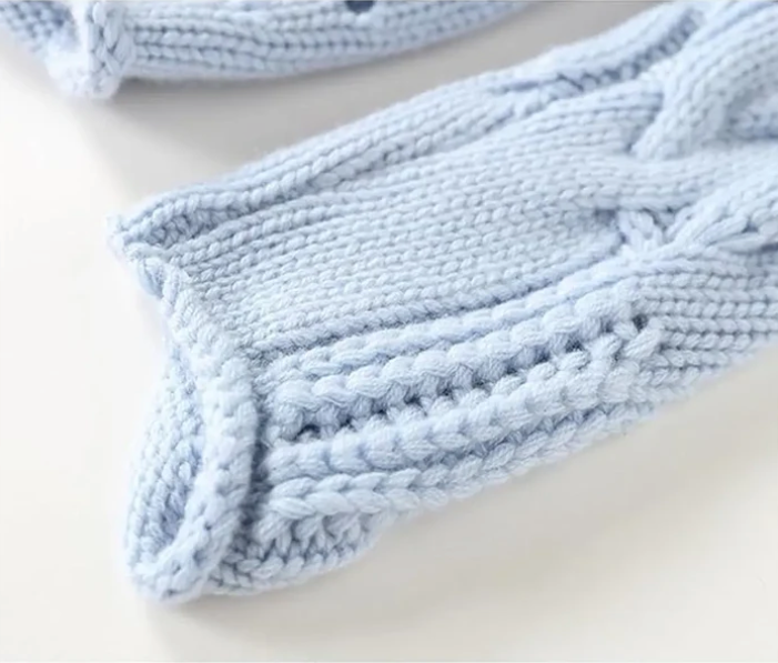Women's blue cable knit turtleneck sweater - sleeve detail