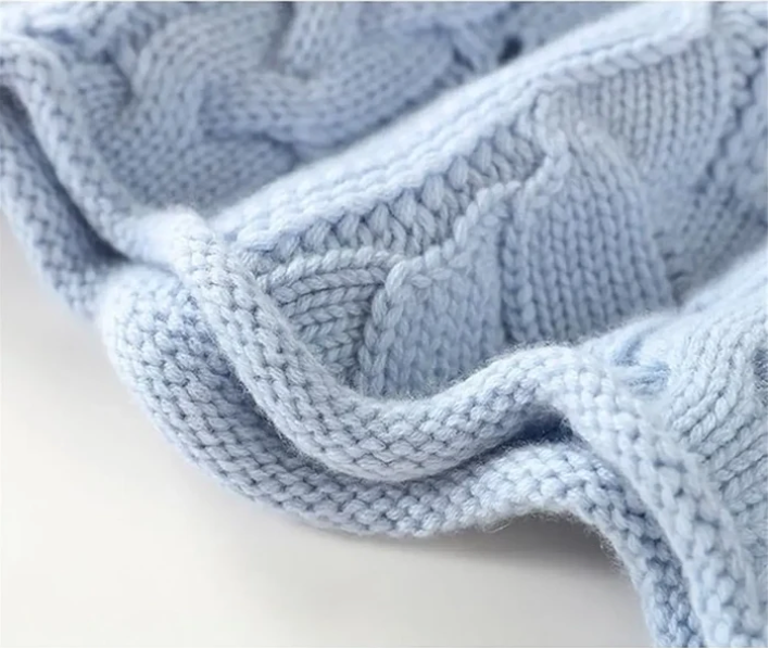 Women's blue cable knit turtleneck sweater - hem detail