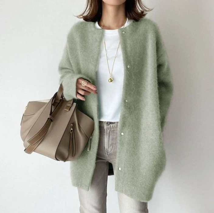 Women's oversized cardigan in green - studio view