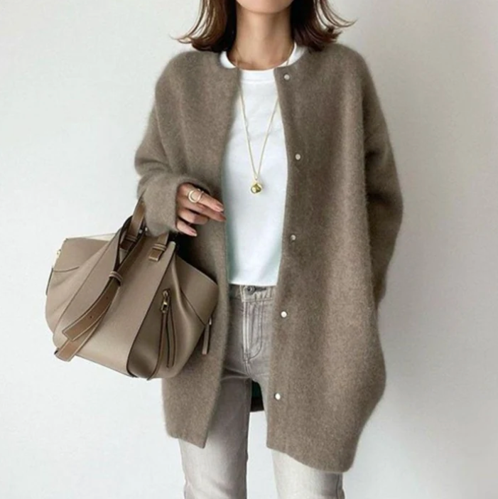 Women's oversized cardigan in beige - studio view