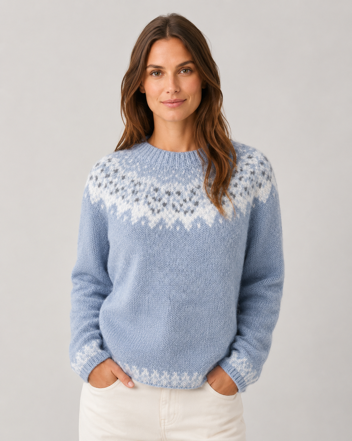 Light blue Fair Isle sweater with white snowflake-inspired yoke